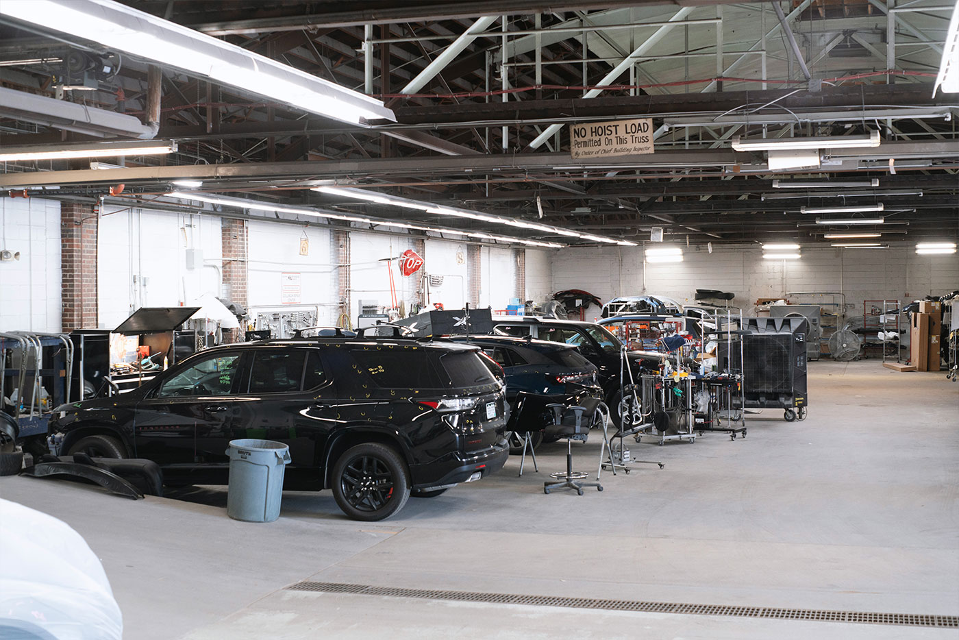 VW Technician servicing a vehicle at the dealership